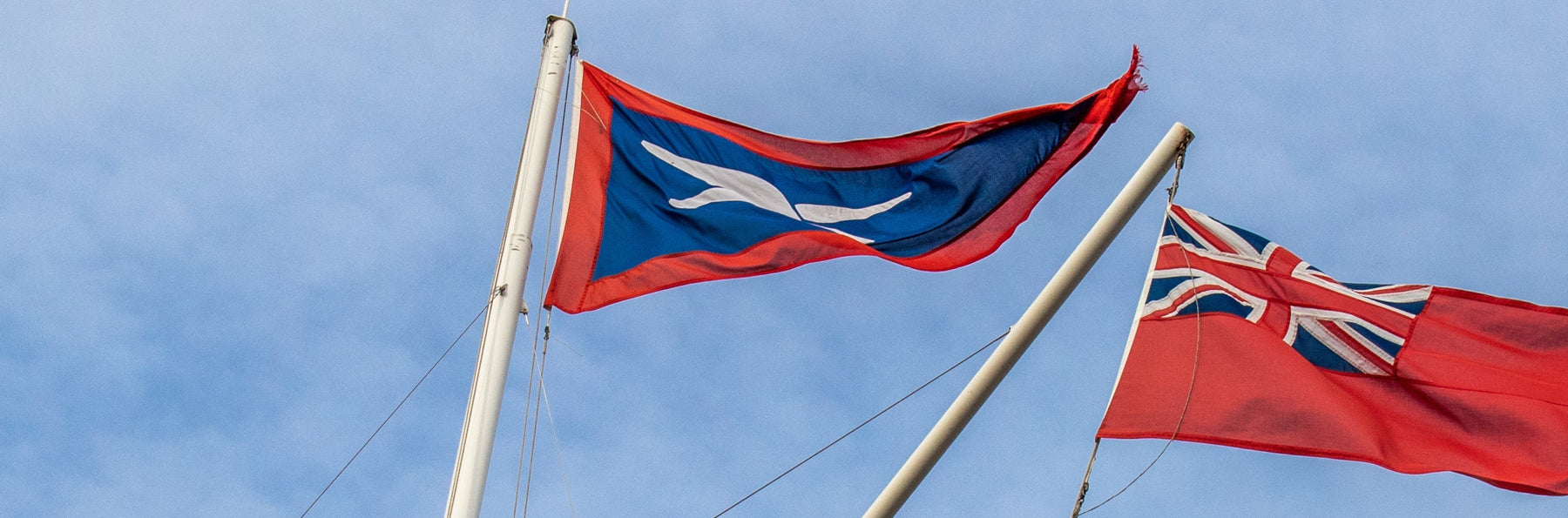 burgee of Deutchser Hochseesportverband and Red Ensigh being flown on in the air