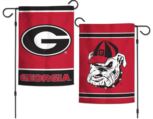 A double-sided Georgia Bulldogs garden flag with one side showing the 'G' logo and the word 'GEORGIA' in capital letters, and the other side showing a cartoon bulldog wearing a cap. Both sides have a red background.