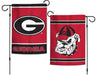 A double-sided Georgia Bulldogs garden flag with one side showing the 'G' logo and the word 'GEORGIA' in capital letters, and the other side showing a cartoon bulldog wearing a cap. Both sides have a red background.