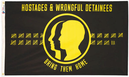 Flag with yellow silhouette of faces and text 'Hostages & Wrongful Detainees Bring Them Home' on a black background
