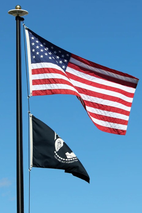Solar powered flagpole light in use on a flagpole